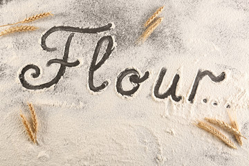Word written on wheat flour, closeup
