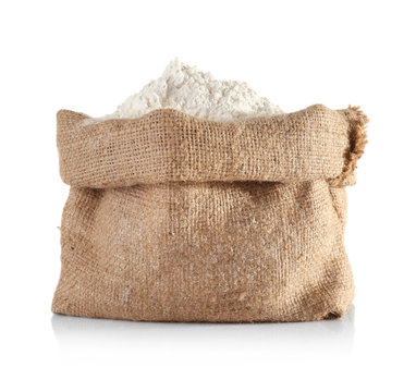 Bag with flour on white background