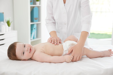 Obraz na płótnie Canvas Doctor examining little baby in clinic. Baby health concept