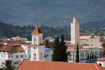 high angle view of a church and a mosque in Chefchaouen - Morocco