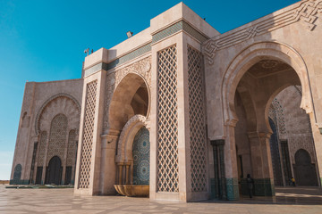 Fototapeta na wymiar view of Hassan ii mosque's big archs against sky