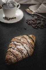 Croissant with chocolate and coffee