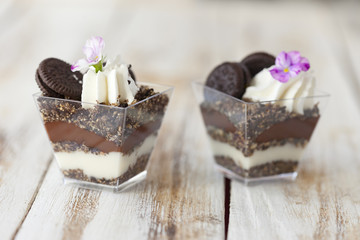 Trifle black and white chocolate with cookie, sweet dessert.