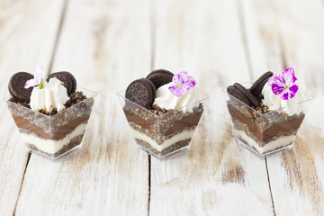 Trifle black and white chocolate with cookie, sweet dessert.