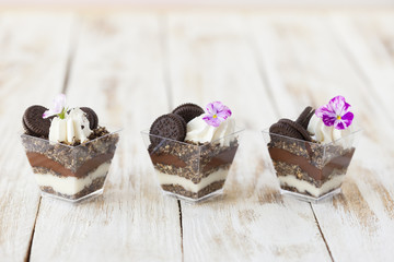 Trifle black and white chocolate with cookie, sweet dessert.