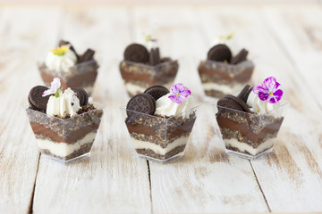 Trifle black and white chocolate with cookie, sweet dessert.