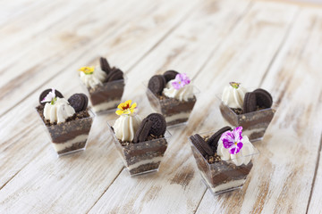 Trifle black and white chocolate with cookie, sweet dessert.