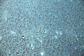 Raindrops on window glass , rainy day