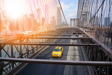 Taxi cab riding on Brooklyn bridge