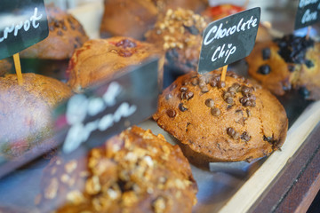 Muffins set on shelf in bakery chop
