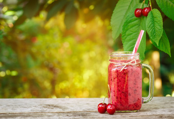 mason jar with cherry smoothie 