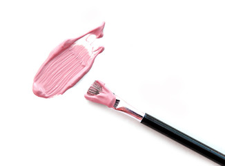 Make up beige foundation with blush on white.