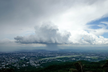 Fototapeta na wymiar Pouring rain and dark clouds over the chiang mai city Thailand