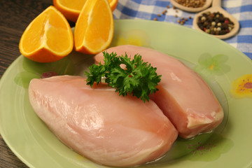 Raw chicken breast and spices close up. Selective focus