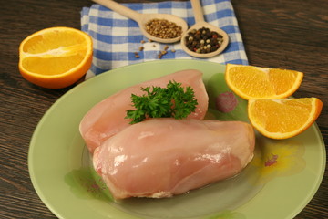Raw chicken breast and spices close up. Selective focus