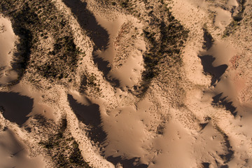Aerial view of massive sand dunes in the arid region of the Northern Cape, South Africa.