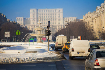 Bucharest city traffic with Parliament building in background, Romania