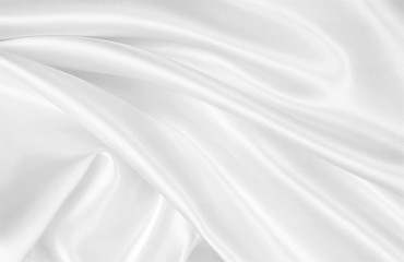 Fototapeta premium Smooth elegant white silk or satin luxury cloth texture as wedding background. Luxurious background design