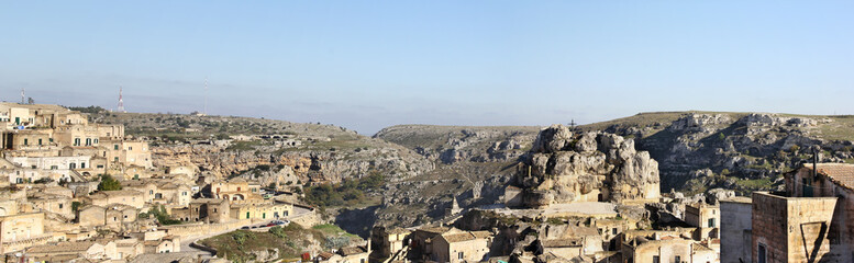 Fototapeta na wymiar Panorama of Matera: the lost city Sassi on the left and the rock church of Madonna de Idris on the right, Puglia, Italy. (large stitched file)