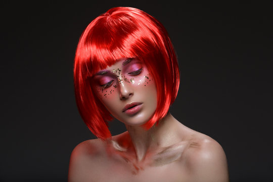Beautiful girl in red wig