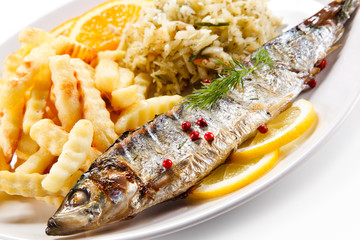 Fish dish - grilled trout with vegetables on white background