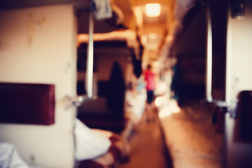 Blurred background people lifestyle background, inside wagon train car.