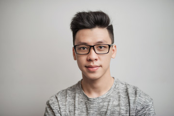 Fototapeta premium Portrait of good looking asian man in glasses