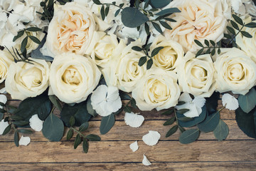 Flower arrangement on wooden background