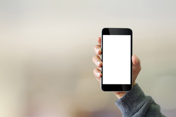 Man using smartphone on blur background.