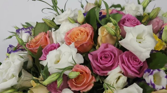 Pink roses and eustoma bouquet with bow . close up