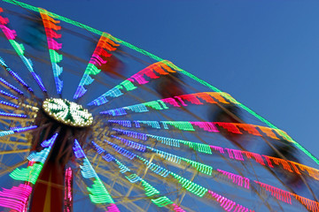 ferris wheel in motion, multi colored lights