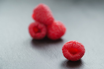 fresh raspberries on slate board