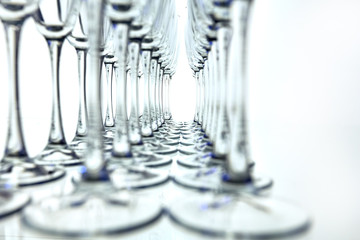 Rows of Empty Wine Glasses on the table white background