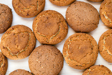 Oatmeal cookies on a wooden table. Oatmeal cookies background. Top view.