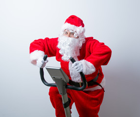 Santa Claus have a fun with Exercise Bikes