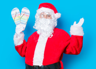 Funny Santa Claus have a fun with flip flops