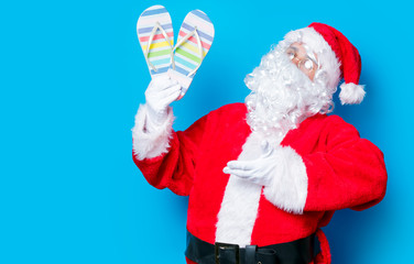 Funny Santa Claus have a fun with flip flops