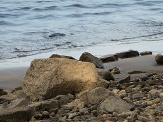 Stones on the banks of the Rhine  illuminated by the sunlight, Kalkar