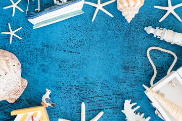Top view Decorative sailing boats and marine items on wooden background.