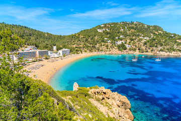 View of beautiful Cala San Vicente bay with azure sea water and beach, Ibiza island, Spain