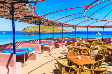 Fototapeta na wymiar Coastal bar with beautiful sea view on Cala Comte beach, Ibiza island, Spain
