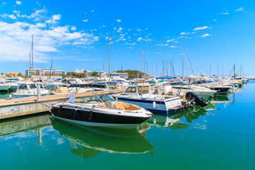 Luxury motor and sailing boats anchoring in Santa Eularia modern marina, Ibiza island, Spain