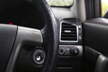Rain splashed into the car.