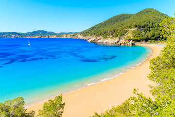 Amazing beach view with azure sea water in Cala San Vicente bay in northern part of Ibiza island, Spain