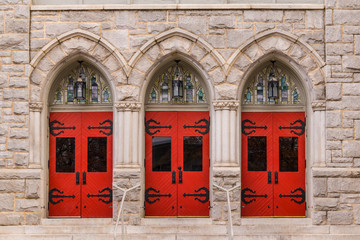 Three doors in a row on the facade of Saint Mark United Methodist Church front view, Atlanta, USA