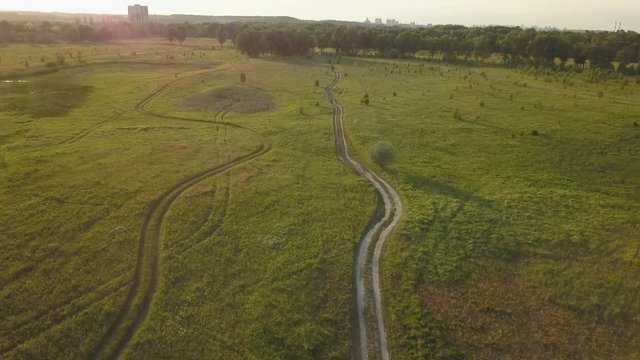 flight of the drone over the fields and rivers