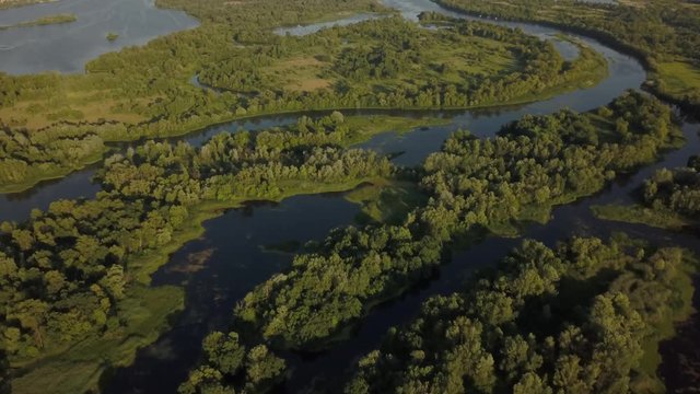 flight of the drone over the fields and rivers