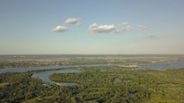 flight of the drone over the fields and rivers