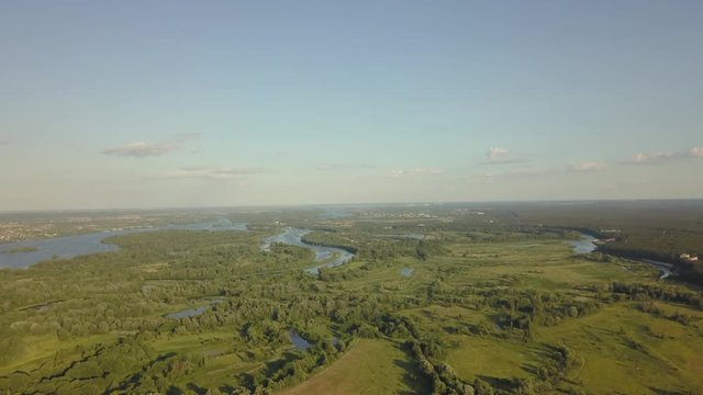 flight of the drone over the fields and rivers