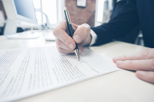 Businessman signing a contract
